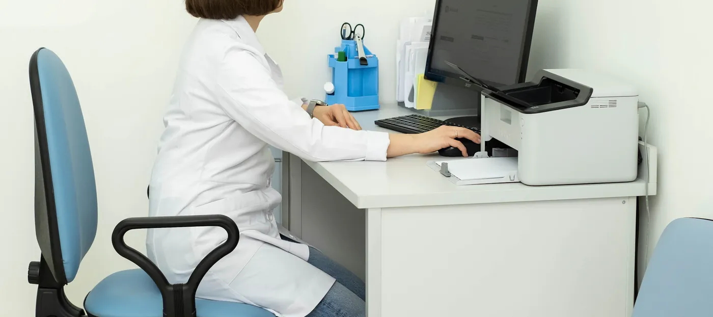 Clinic receptionist at the front desk