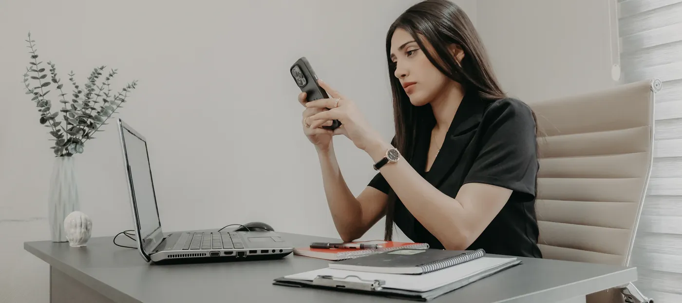 Manager answering a customer on her phone