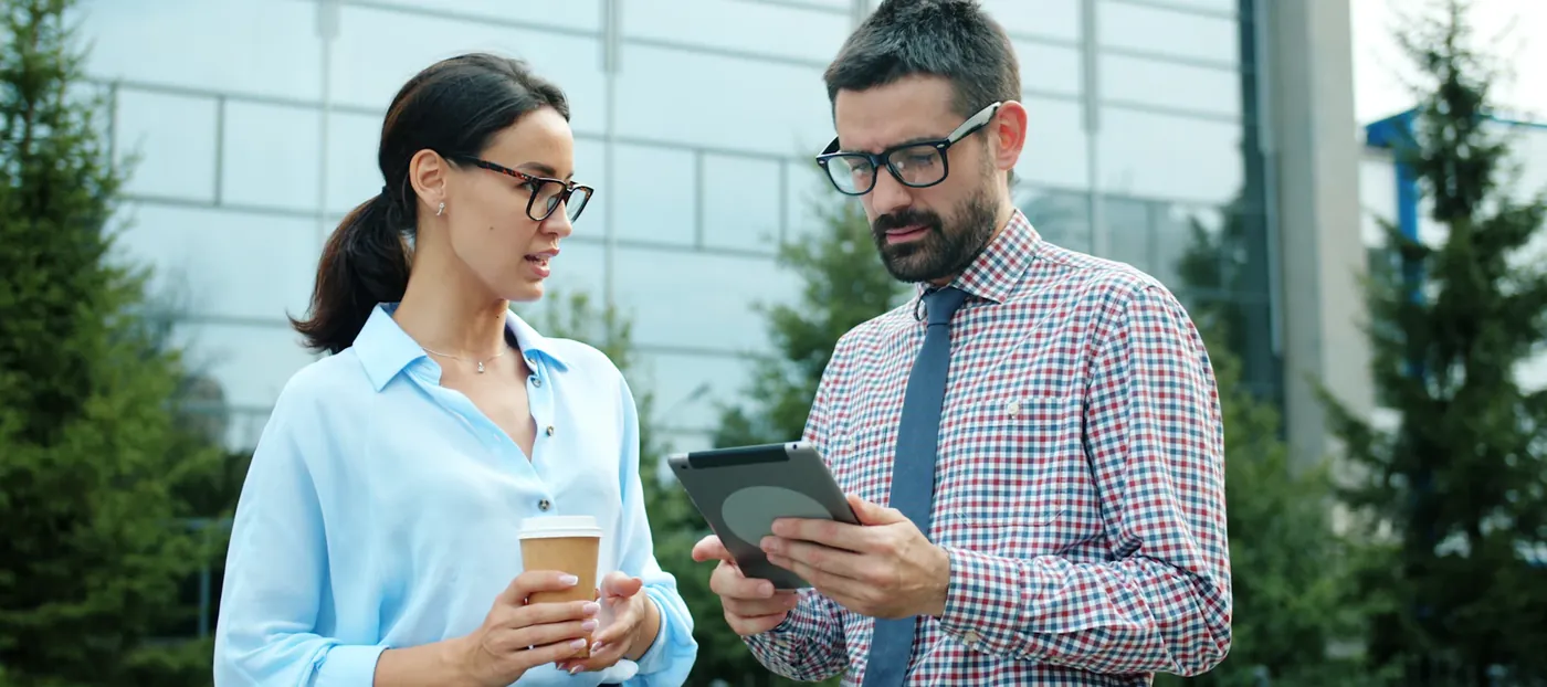 Agent showing a client details on a tablet