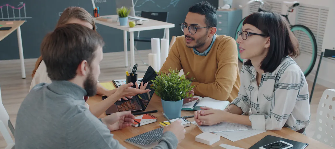 Team working together around a table