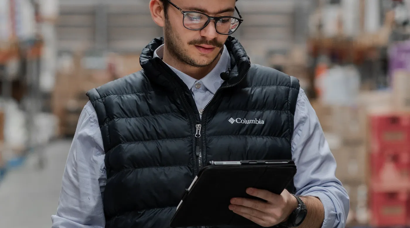 Wholesaler checking stock on a tablet in the warehouse